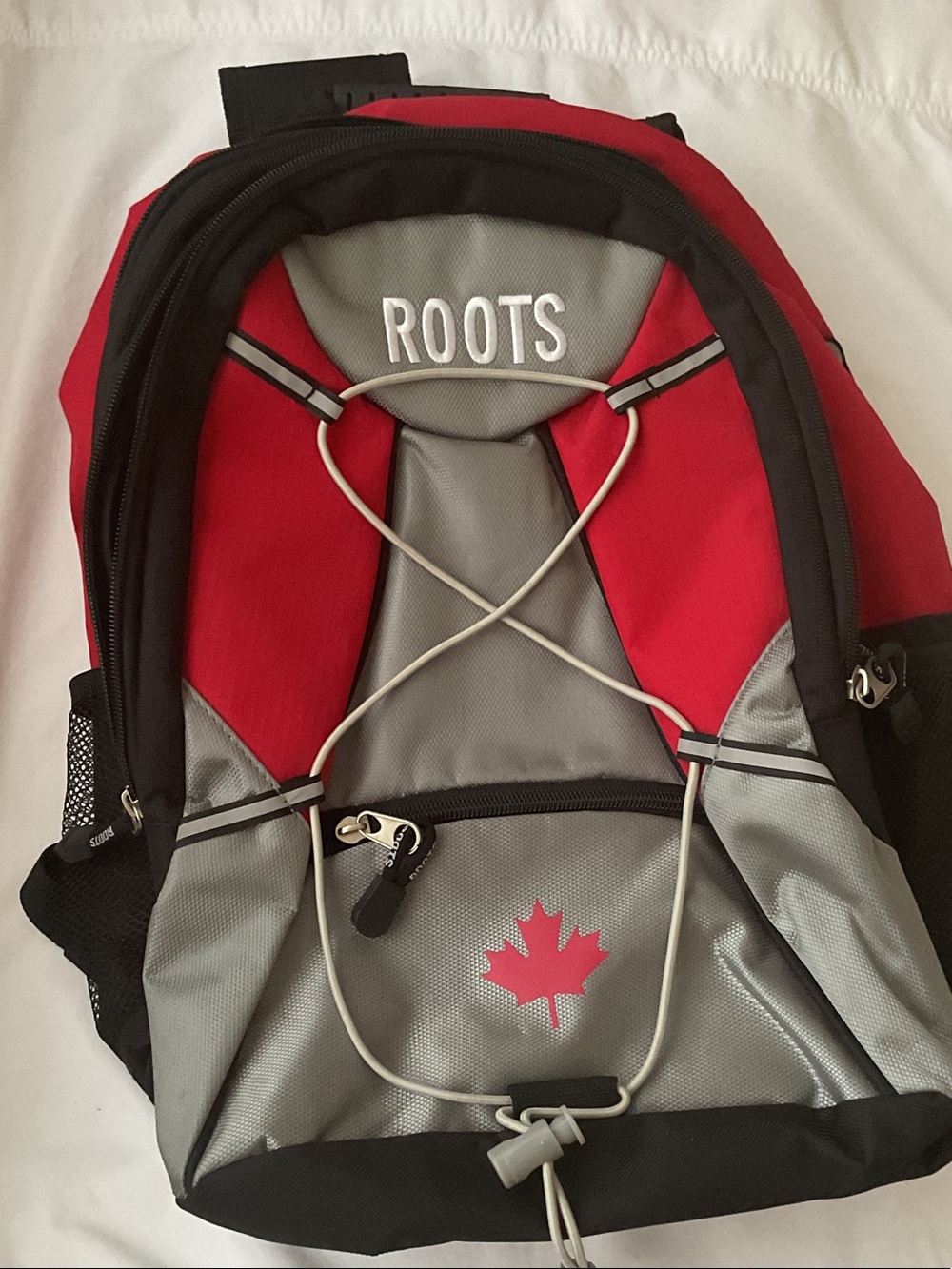 Roots Red and Gray Men's Backpack with Bungee Front and Canada Maple Leaf Logo